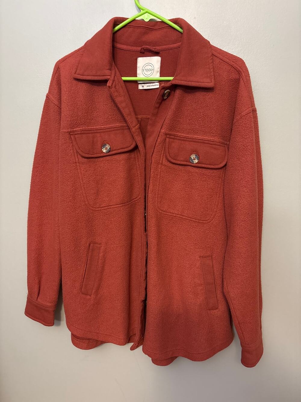 Stoosh fleece shacket with front button closure and two patch pockets. Sz M